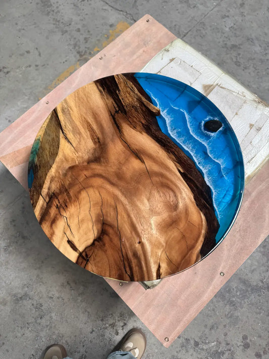 Flowepoxytable Custom Walnut Epoxy Ocean Beach Side Table RT032 shown with its handcrafted round resin surface